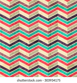 Geometric seamless pattern - colorful zigzags with folds. Eps 10 with a grunge texture. Vintage style backdrop