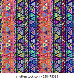Geometric seamless pattern in ethnic style. Bright colorful shapes triangles, strips and zigzags on a dark background.