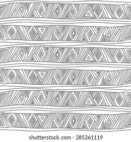 Geometric seamless pattern in ethnic style. The complex structure of triangles, diamonds and stripes painted hands.