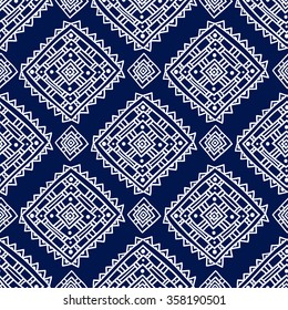 Geometric seamless pattern in ethnic style. Blue and white graphics, diamonds, triangles, painted by hand. 