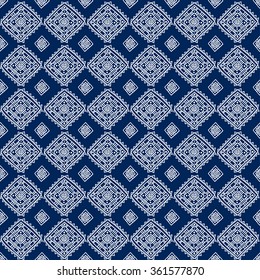 Geometric seamless pattern in ethnic style. The structure of classical folk motifs on a blue background.