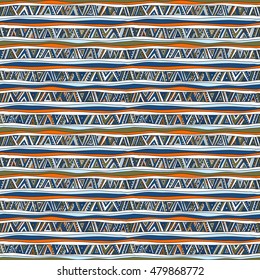 Geometric seamless pattern in ethnic style. Tribal, folk traditional motifs. Triangles, zigzags, stripes. Cheerful motley color.