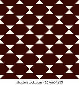 Geometric seamless pattern. Ethnic, tribal suface print. Repeate hourglass, triangle motif ornament. Minimal shapes background. Simple geo ornamental wallpaper. Vector abstract digital paper