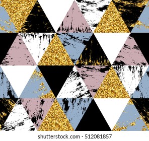 Geometric seamless pattern with gold and hand drawn texture triangles. 