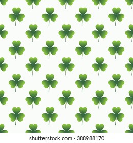 Geometric seamless pattern with green clover for St. Patrick Day on the white background. 