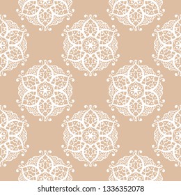 Geometric seamless pattern in indian style. White design on beige background