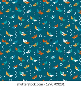 Geometric seamless pattern with paper boats. Print on blue with kids style ships. Nice colorful simple background.