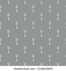 Geometric seamless pattern with repetitive crossed arrows on grey backdrop for Christmas theme designs.vector illustration 