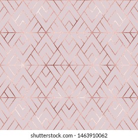 Geometric seamless pattern with rose gold triangle tiles.