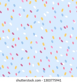 Geometric seamless pattern with sprinkles topping on light blue background. Perfect for wallpaper, gift paper, spring greeting cards