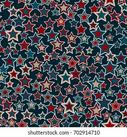 Geometric seamless pattern. The stars of different sizes and colors arranged on a dark blue background. Useful as design element for texture and artistic compositions.