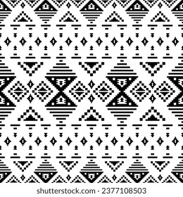 Geometric seamless pixel pattern with Aztec Navajo tribal motif. Abstract background with ethnic style. Design for fabric, textile, clothing, carpet, ikat, batik, embroidery. Black and white colors.