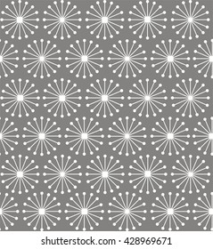 Geometric shapes of lines rays forming a circle in white color. A seamless pattern on a gray background.