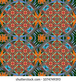Geometric stylized multicolored seamless pattern. Vector modern geometrical abstract background in brown, orange and blue colors. Texture, new background.