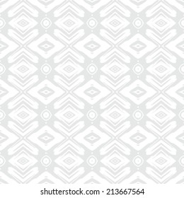 Geometric texture in ethnic style in silver and white for Christmas and holiday decor or wedding invitation background. Seamless vector pattern for winter fashion