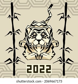 Geometric tiger on paper-color background. Symmetric oriental zodiac symbol of 2022 and bamboo