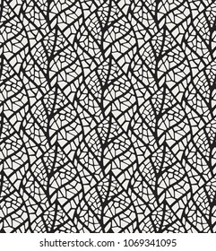 Geometric trendy leaves vector seamless pattern. Abstract symmetry vector texture. Leaf background.
