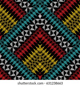 Geometric tribe seamless pattern. Modern colorful vector tribal aztec navajo background with abstract  squares, rhombus, triangles, shapes, figures.Grunge arras tapestry texture with embroidery effect