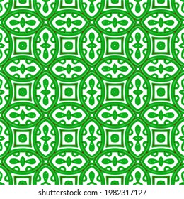 Geometric vector pattern with green and red colors. Seamless abstract ornament for wallpapers and backgrounds.