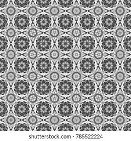 Geometrical abstract tiles mosaic seamless pattern background - vector graphic with abstract shapes in black, white and gray tones.