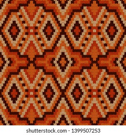Geometrical ornate seamless knitted vector pattern as a fabric texture in brown, beige and orange colors