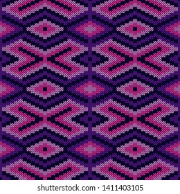 Geometrical ornate seamless knitted vector pattern as a fabric texture in violet, magenta and pink colors