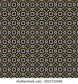 Geometrical pattern in yellow, blue and pink against a black background.