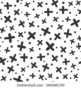 Geometrical seamless pattern with crosses and round spots. Drawn by hand, sketch, doodle. Modern vector illustration.