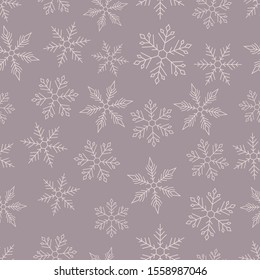 Geometry snowflowek on muted pink background. Seamless winter pattern.