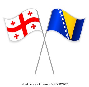 Georgian and Bosnian crossed flags. Georgia combined with Bosnia and Herzegovina isolated on white. Language learning, international business or travel concept.