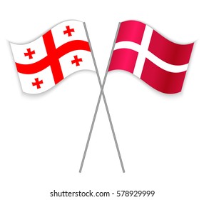 Georgian and Danish crossed flags. Georgia combined with Denmark isolated on white. Language learning, international business or travel concept.