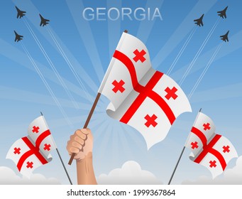 Georgian flags flying under the blue sky