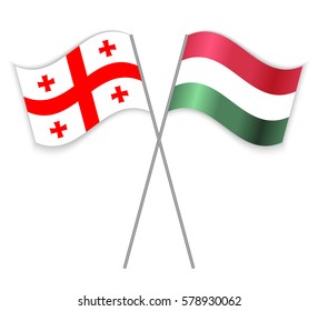 Georgian and Hungarian crossed flags. Georgia combined with Hungary isolated on white. Language learning, international business or travel concept.