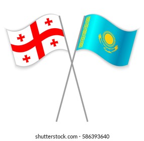 Georgian and Kazakh crossed flags. Georgia combined with Kazakhstan isolated on white. Language learning, international business or travel concept.