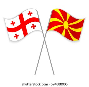 Georgian and Macedonian crossed flags. Georgia combined with Macedonia isolated on white. Language learning, international business or travel concept.