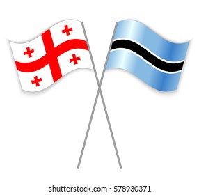 Georgian and Motswana crossed flags. Georgia combined with Botswana isolated on white. Language learning, international business or travel concept.