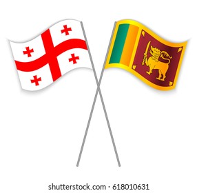 Georgian and Sri Lankan crossed flags. Georgia combined with Sri Lanka isolated on white. Language learning, international business or travel concept.