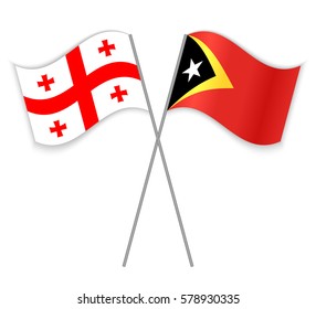 Georgian and Timorese crossed flags. Georgia combined with East Timor isolated on white. Language learning, international business or travel concept.