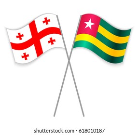 Georgian and Togolese crossed flags. Georgia combined with Togo isolated on white. Language learning, international business or travel concept.