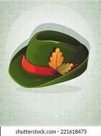 German Alpine Oktoberfest hat with oak leaves on an abstract background