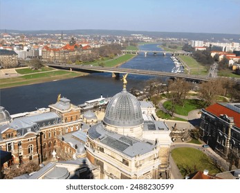 The German city of Dresden, with its dome (Frauenkirche), art museum (Albertinum), Academy of Fine Arts, bridges over the Elbe river, and the Old town; an aerial view during a spring day.