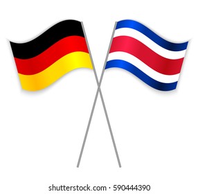 German and Costa Rican crossed flags. Germany combined with Costa Rica isolated on white. Language learning, international business or travel concept.