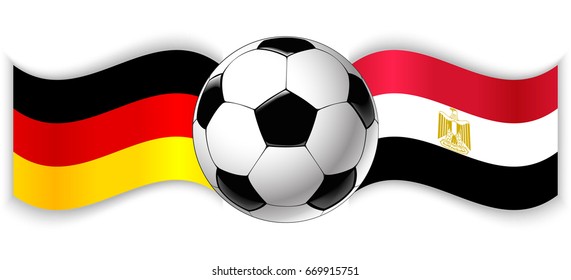 German and Egyptian wavy flags with football ball. Germany combined with Egypt isolated on white. Football match or international sport competition concept.