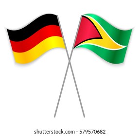 German and Guyanese crossed flags. Germany combined with Guyana isolated on white. Language learning, international business or travel concept.