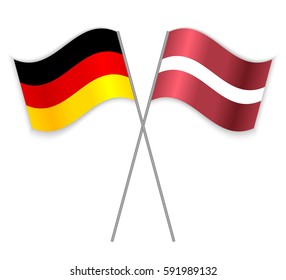 German and Latvian crossed flags. Germany combined with Latvia isolated on white. Language learning, international business or travel concept.