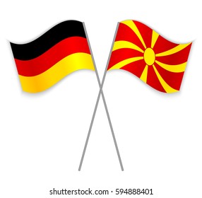 German and Macedonian crossed flags. Germany combined with Macedonia isolated on white. Language learning, international business or travel concept.