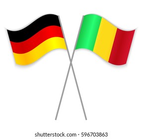 German and Malian crossed flags. Germany combined with Mali isolated on white. Language learning, international business or travel concept.