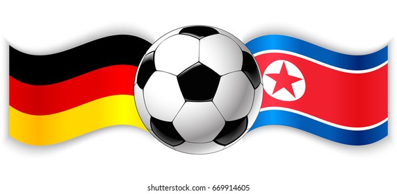 German and North Korean wavy flags with football ball. Germany combined with North Korea isolated on white. Football match or international sport competition concept.