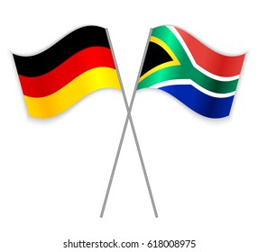 German and South African crossed flags. Germany combined with South Africa isolated on white. Language learning, international business or travel concept.