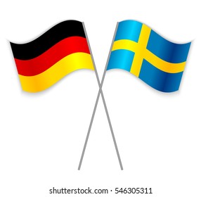 German and Swedish crossed flags. Germany combined with Sweden isolated on white. Language learning, international business or travel concept.